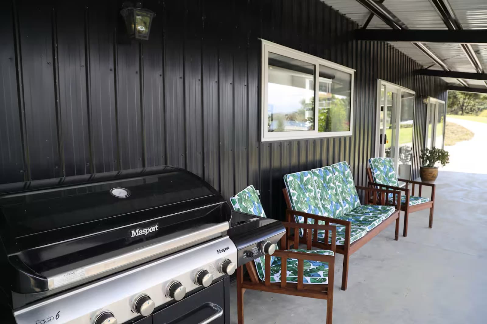 The BBQ and outdoor seating on the lower deck
