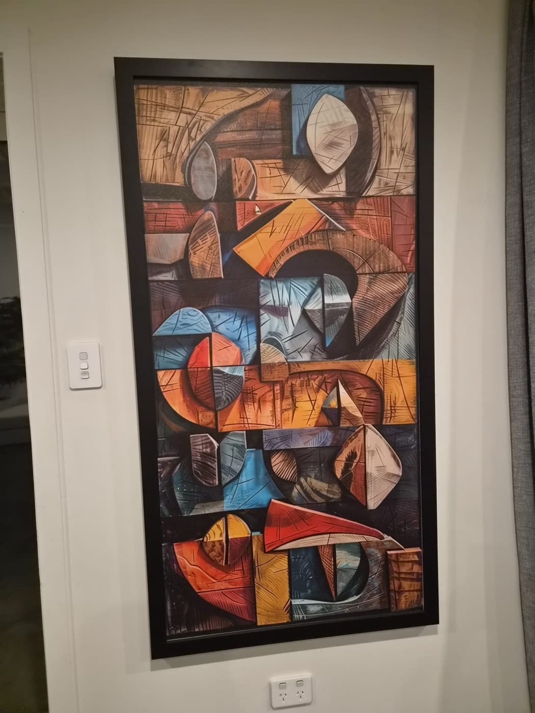 A bold framed artwork by the lounge