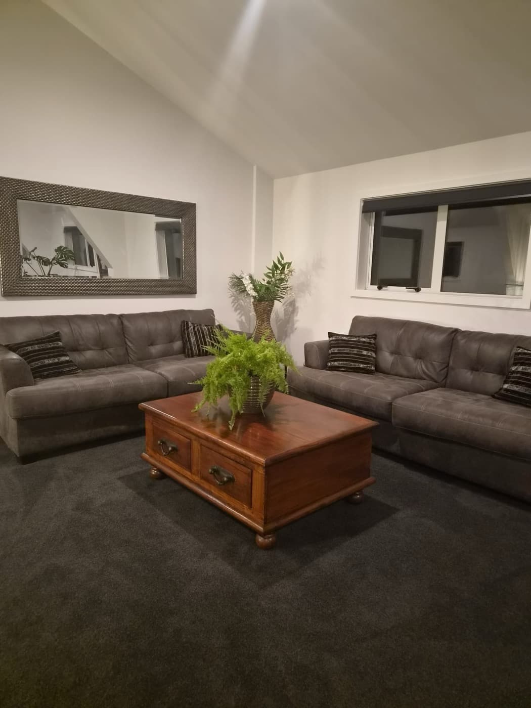 A framed mirror above the lounge