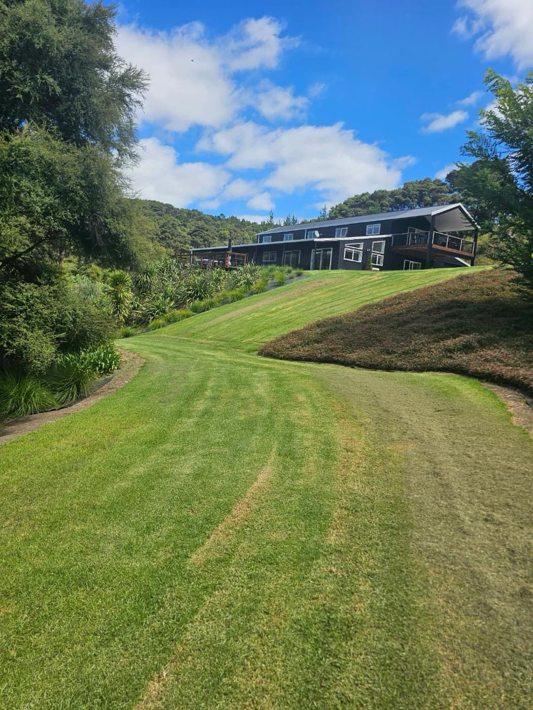 The house above the sweeping lawn