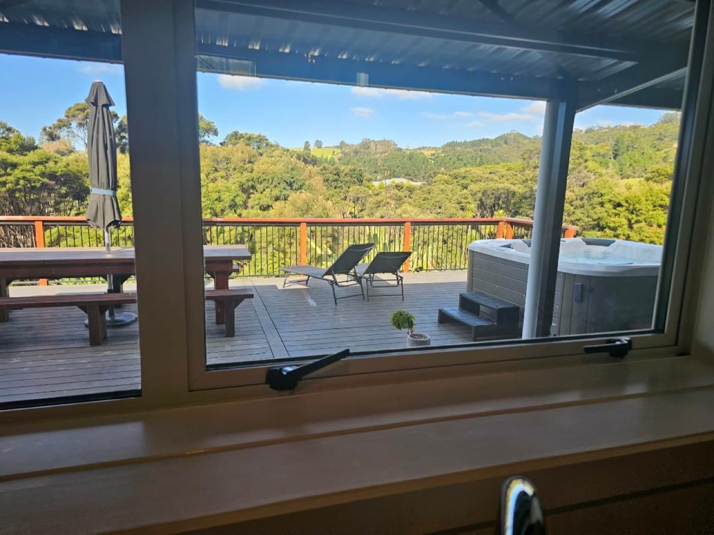 The valley and deck through the kitchen window